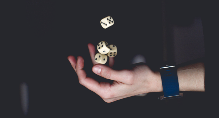 hand tossing up dice